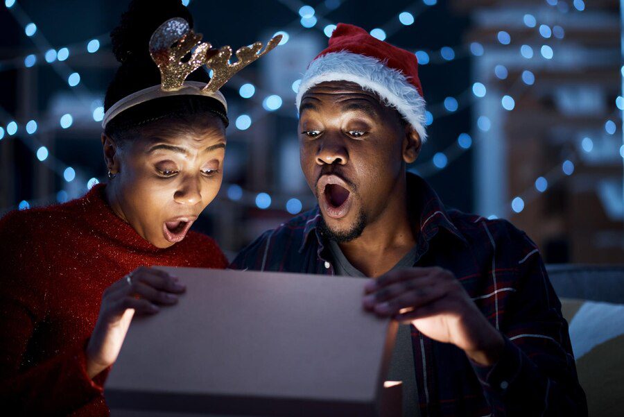 black couple box christmas gift open surprise wow shock by magic light looking excited night couple gift box fantasy omg amazed while sharing festive holiday home 590464 109247